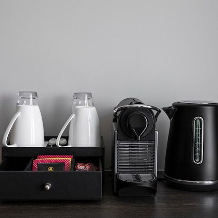 Oakwood Premier Melbourne Aparthotel Kültér fotó A Nespresso coffee machine in a hotel room